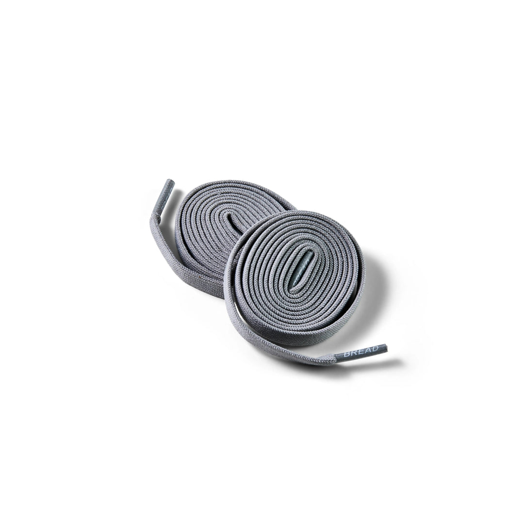 Gray elastic shoelace by Bread, Vulture Gray color, with flexible, stretchable design for comfortable footwear.