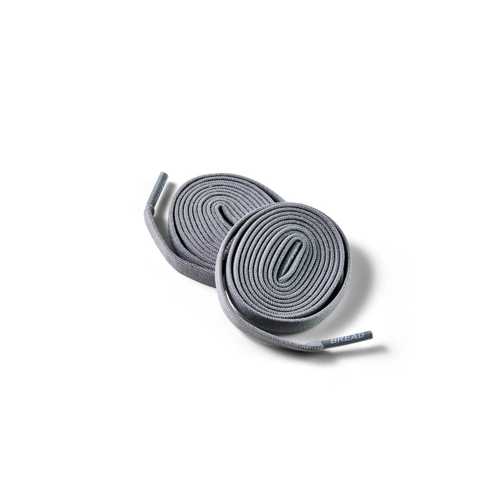 Gray elastic shoelace by Bread, Vulture Gray color, with flexible, stretchable design for comfortable footwear.