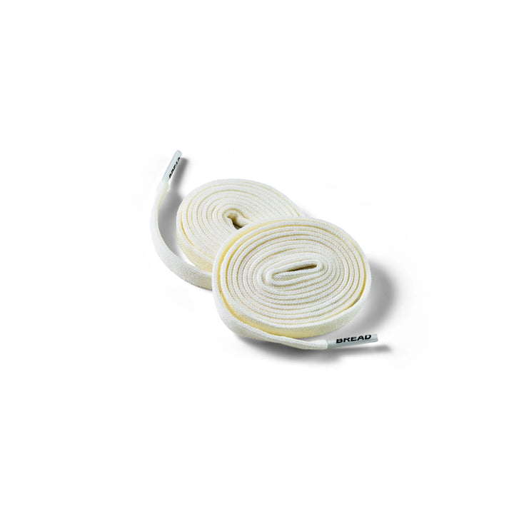 Elastic shoelace in Luxe Creme color by Bread, featuring a sleek, smooth design ideal for comfortable, stylish footwear.