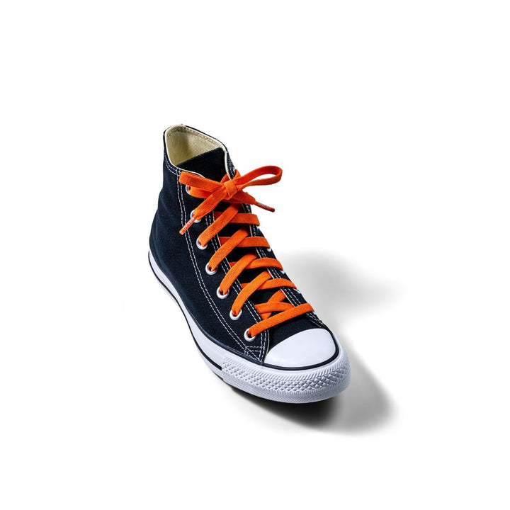 Orange coral elastic shoelace by Bread, showing flexible, stretchy cord with metal aglets for easy lacing.