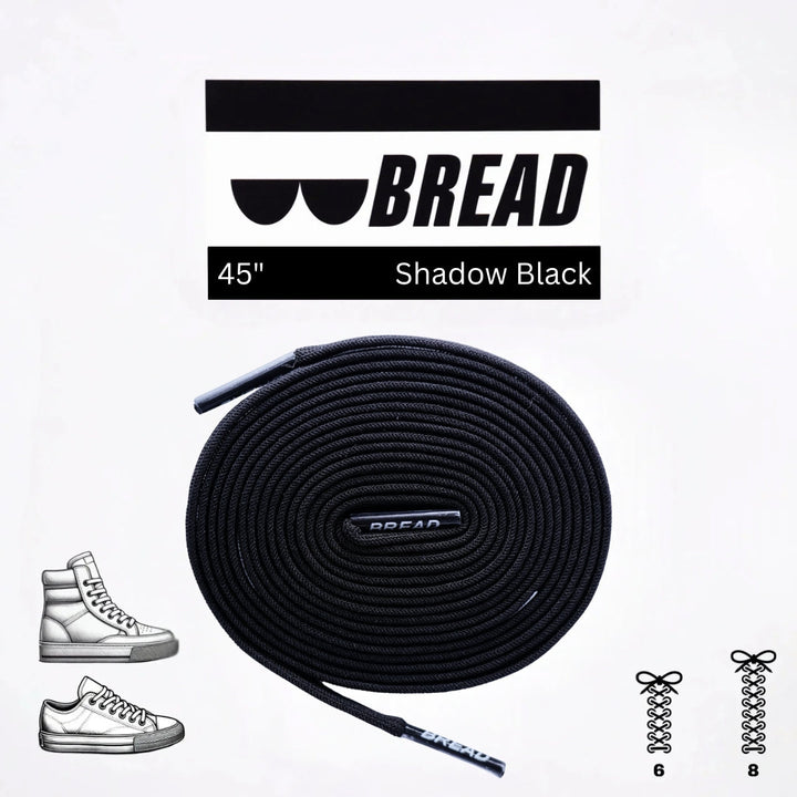Black elastic shoelace by Bread, showing a close-up of the Shadow Black style with smooth, stretchy material and secure aglets.