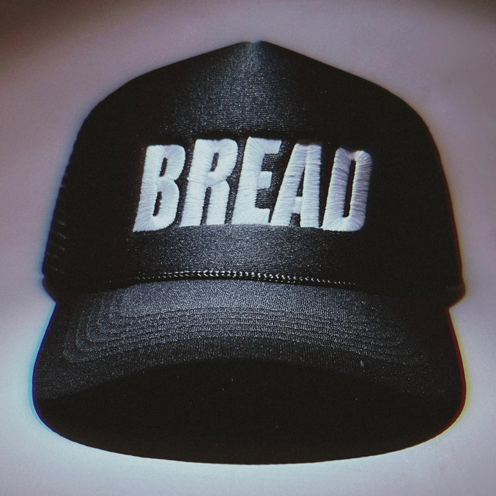 Bread brand bread-shaped hat with realistic bread loaf design and soft fabric texture, perfect for costume or novelty wear.