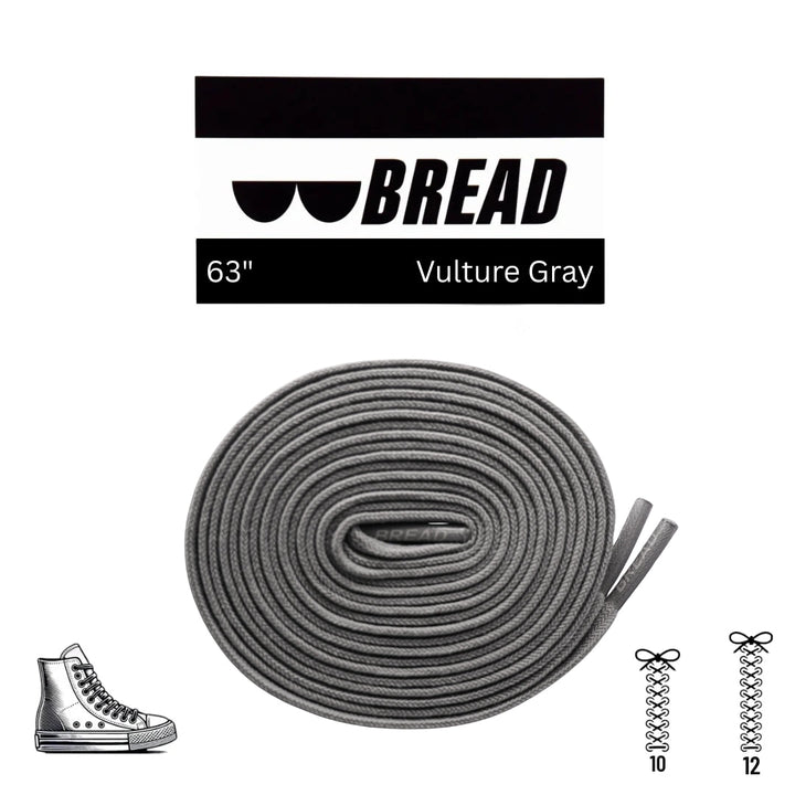 Gray elastic shoelace by Bread labeled "Vulture Gray" shown threaded through sneaker eyelets for a snug fit.