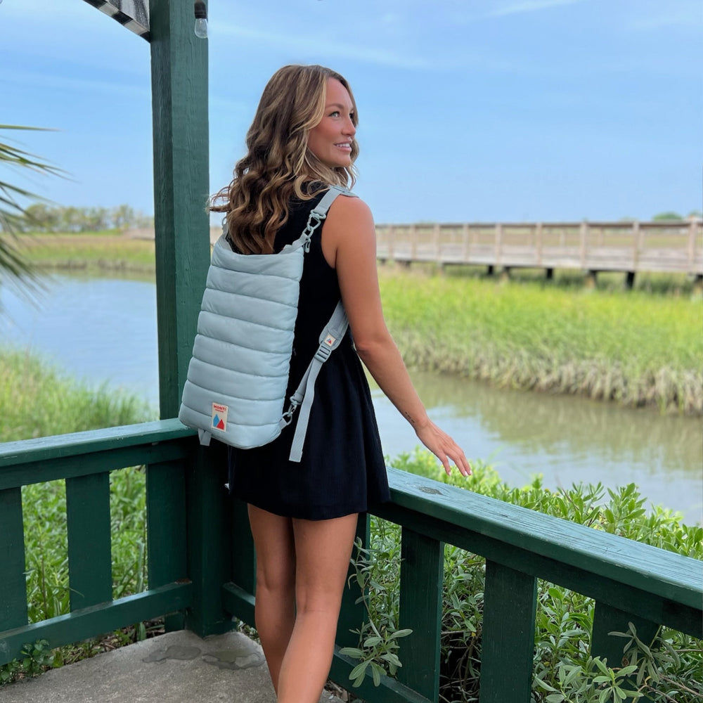 Blue Monti Coolers Mayfly 14L cooler backpack with adjustable straps and durable design for outdoor use.