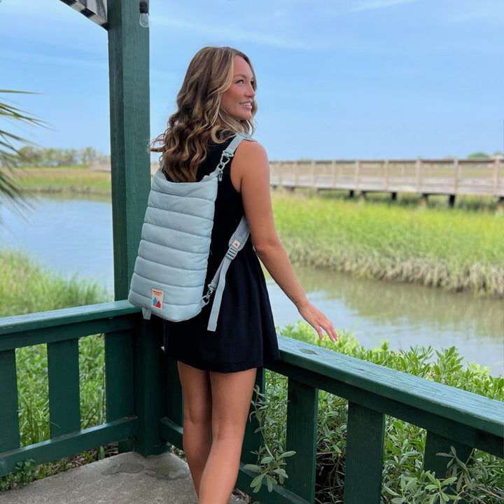 Blue Monti Coolers Mayfly 14L cooler backpack with adjustable straps and durable design for outdoor use.