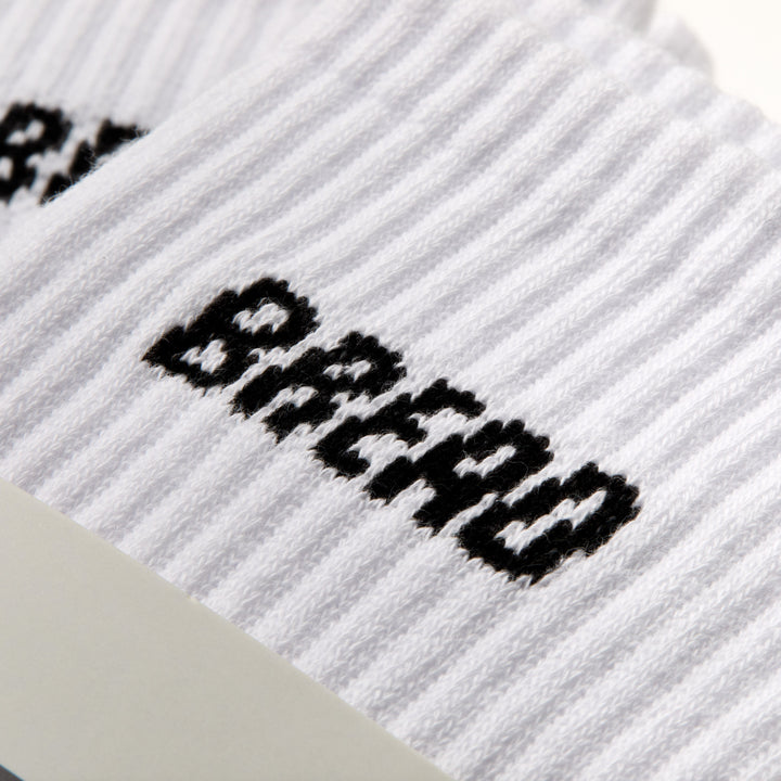 Pair of Bread Crew Socks featuring colorful Bread logo and vibrant knit pattern, casual and comfortable footwear accessory.