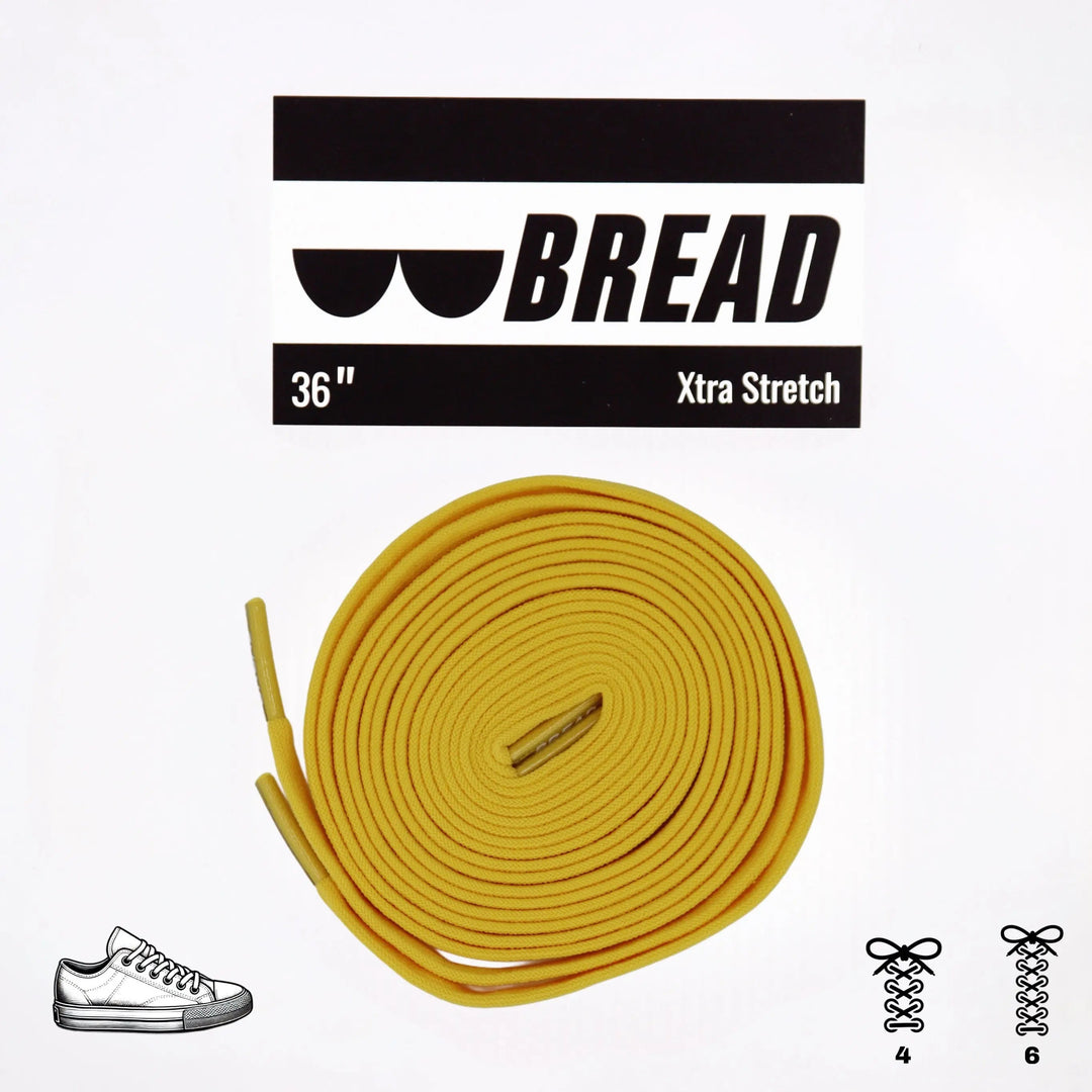 Yellow elastic shoelace by Bread, designed for comfortable, stretchable fit on casual shoes.