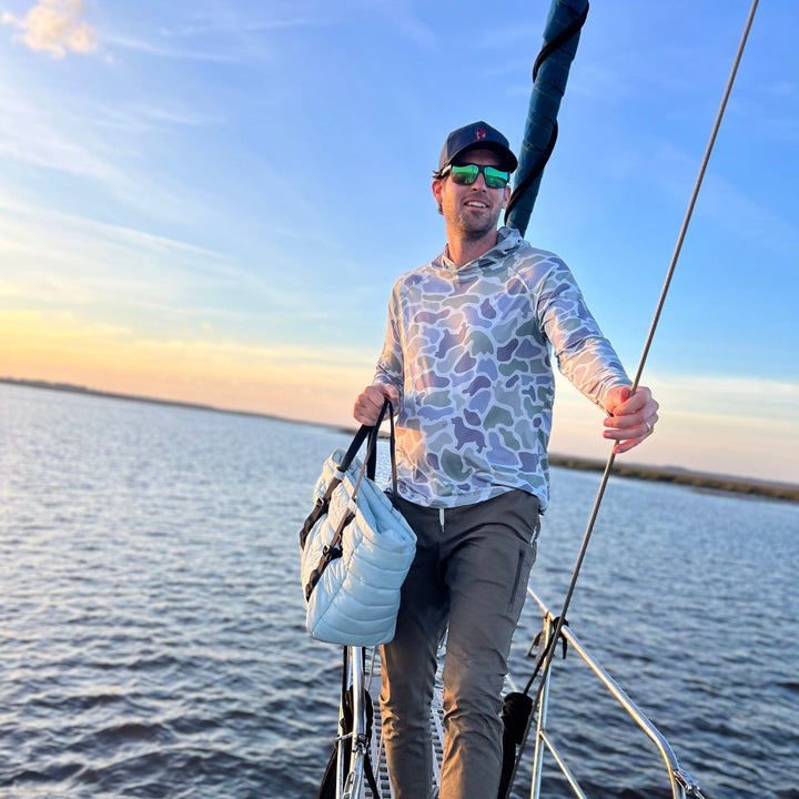 Monti Coolers Loyal Companion Sun Hoodie in camouflage with SPF 50, lightweight fabric, and adjustable hood for outdoor protection.