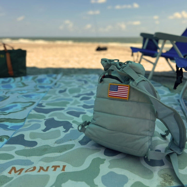 Camo The Big Ass Towel by Monti Coolers featuring a large camouflage pattern for beach or pool use.