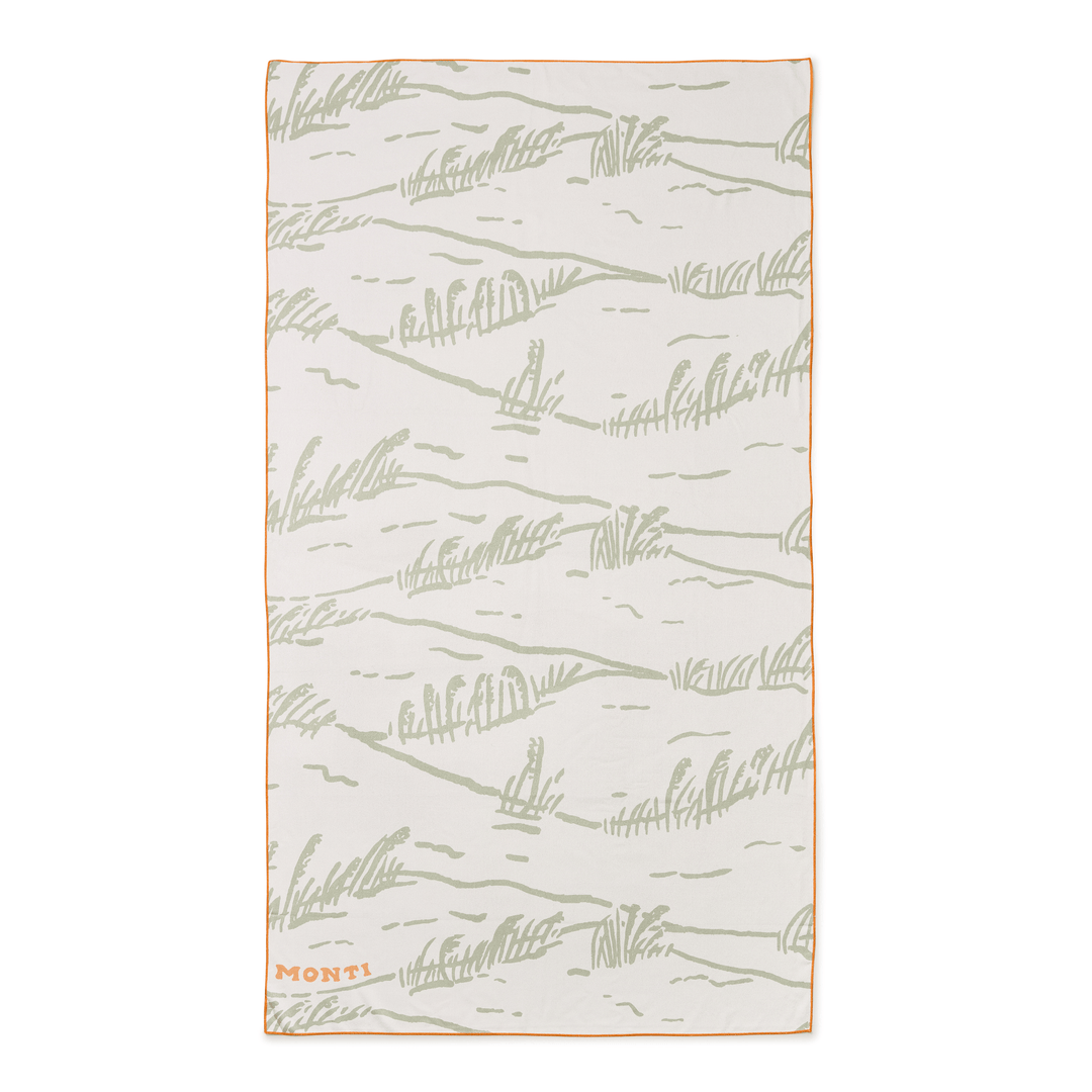 Dune-colored beach towel from Monti Coolers' The Big Ass Towel collection, featuring a large, plush, and absorbent design.