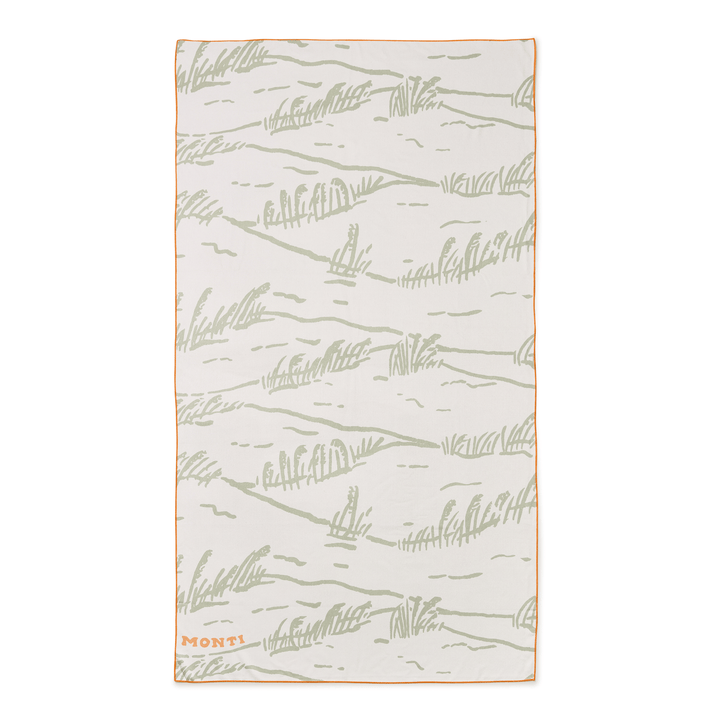 Dune-colored beach towel from Monti Coolers' The Big Ass Towel collection, featuring a large, plush, and absorbent design.