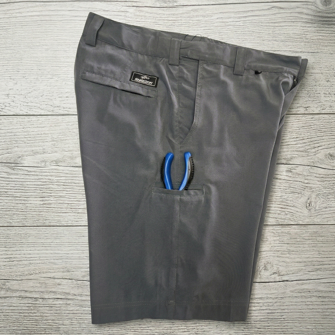 ShredFin HookSet shorts with plier pocket featuring durable fabric and practical design for outdoor activities.