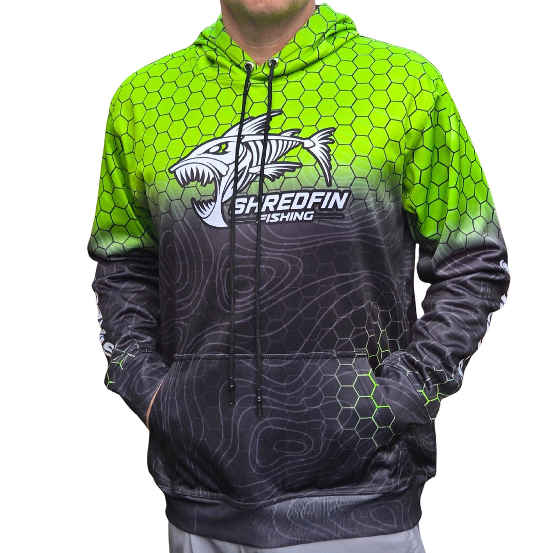 ShredFin HexCast Elite performance hoodie in chartreuse and black fade, showcasing a stylish hoodie with a drawstring hood and logo details.