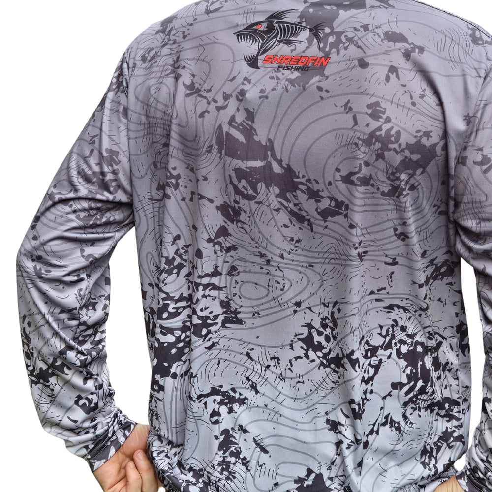 ShredFin Contourz Performance Shirt in Tungsten Splash, casual wear, shown outdoors after lake fishing with a friend.