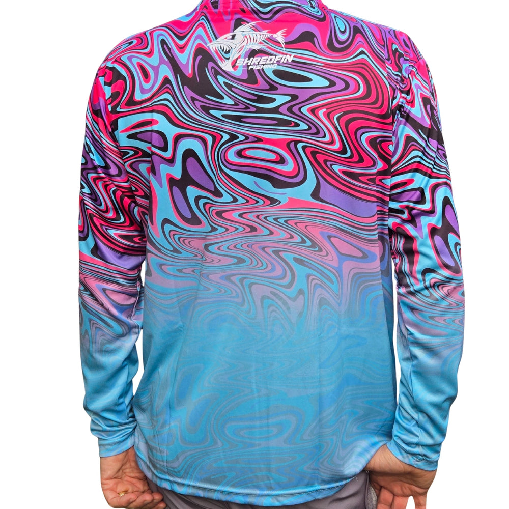 ShredFin StormSurge Performance Shirt in neon swirl, worn by a person and a dog after lake fishing, showing vibrant design.