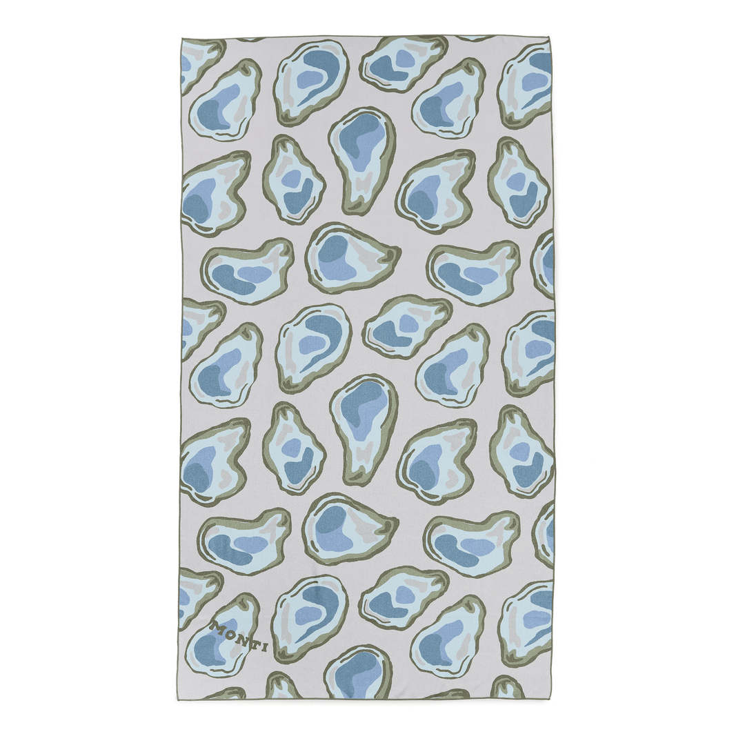 Oyster-colored towel from Monti Coolers' The Big Ass Towel collection, showing soft, plush fabric and large size.