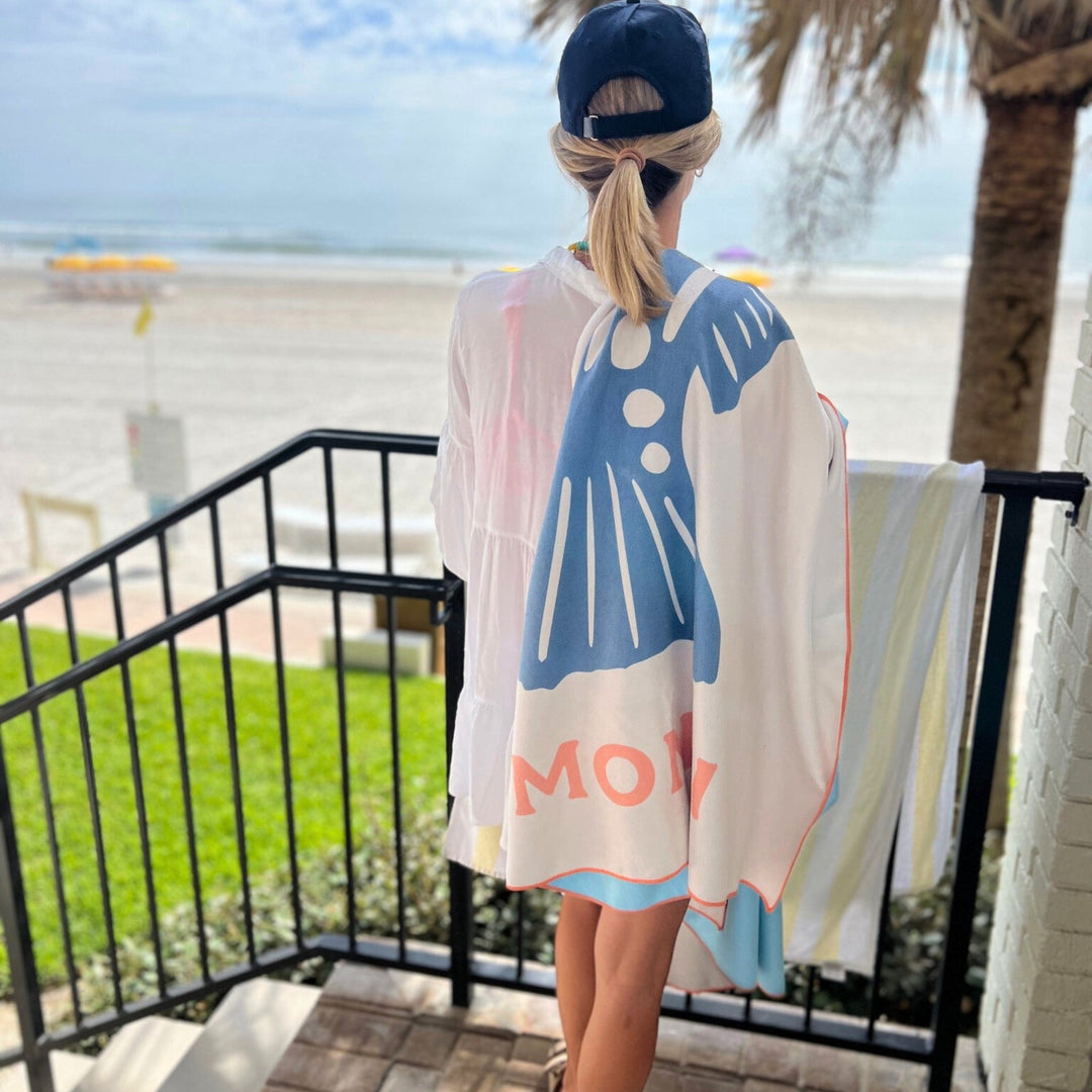 Red fish-themed towel from Monti Coolers' The Big Ass Towel collection, featuring vibrant redfish illustrations on soft fabric.