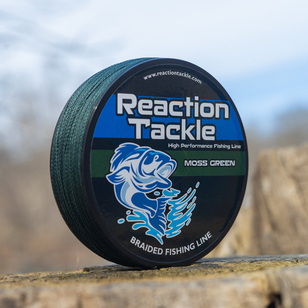 Reaction Tackle braided fishing line in moss green, showing the strong, tightly woven braided fishing line on a reel.
