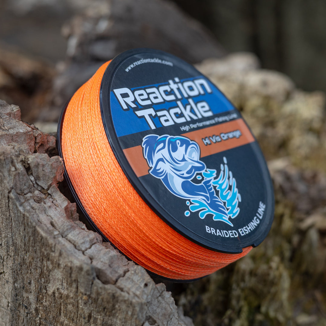 Reaction Tackle braided fishing line in hi-vis orange, showcasing the durable, tightly woven braided fishing line with bright color.