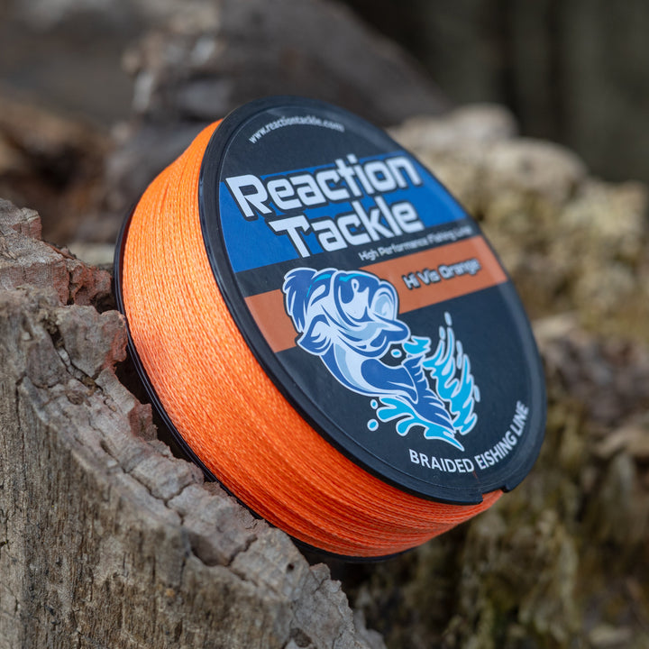 Reaction Tackle braided fishing line in hi-vis orange, showcasing the durable, tightly woven braided fishing line with bright color.