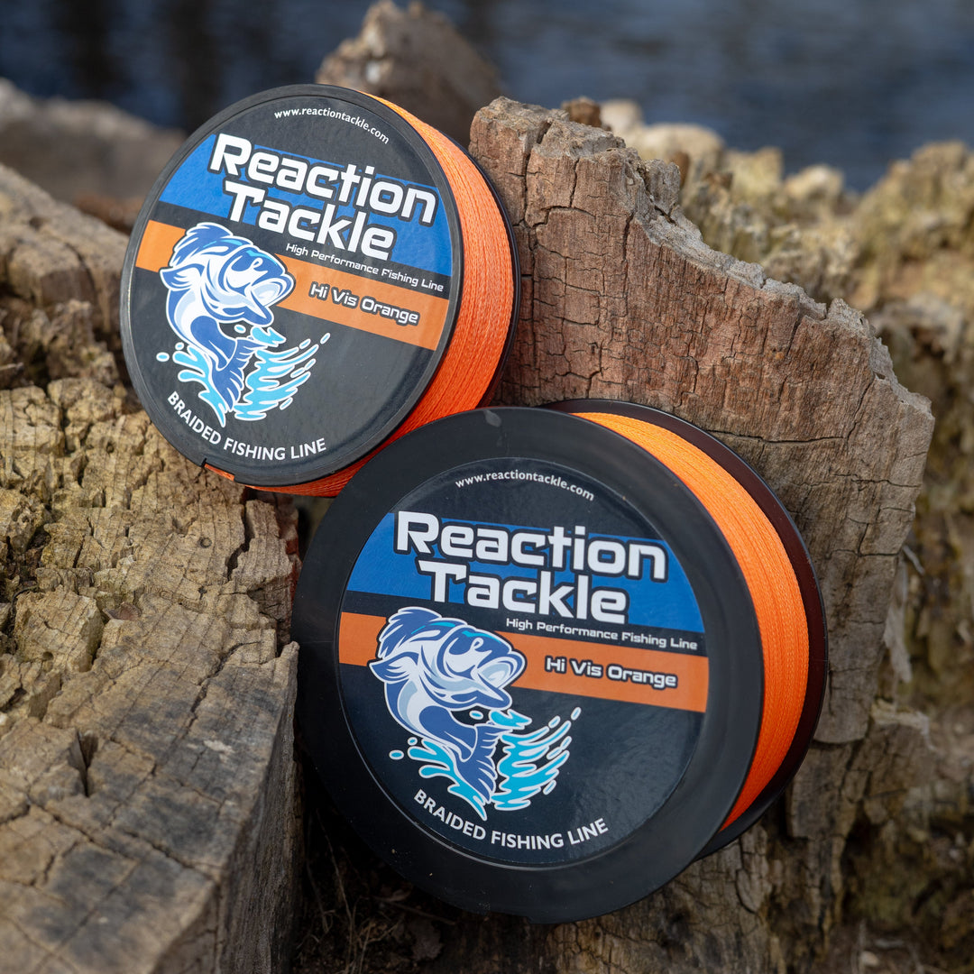 Reaction Tackle braided fishing line in vibrant hi-vis orange, showing the durable, tightly woven texture of the fishing line.