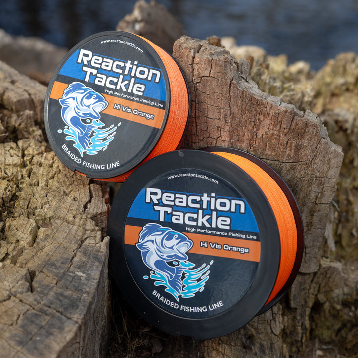Reaction Tackle braided fishing line in vibrant hi-vis orange, showing the durable, tightly woven texture of the fishing line.