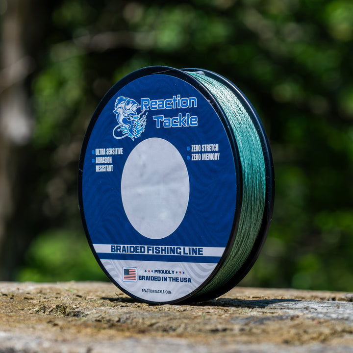 Reaction Tackle braided fishing line in USA, close-up of the durable, tightly woven braided fishing line with Reaction Tackle branding.