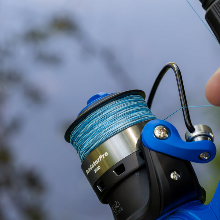 Reaction Tackle braided fishing line, USA-made, shown coiled on spool with clear labeling and high-quality braided texture.