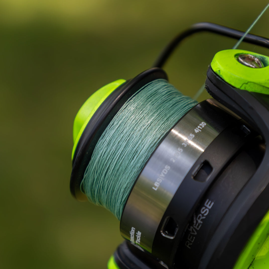 Reaction Tackle braided fishing line in the USA, close-up of tightly woven, clear braided fishing line on a spool for saltwater or freshwater.