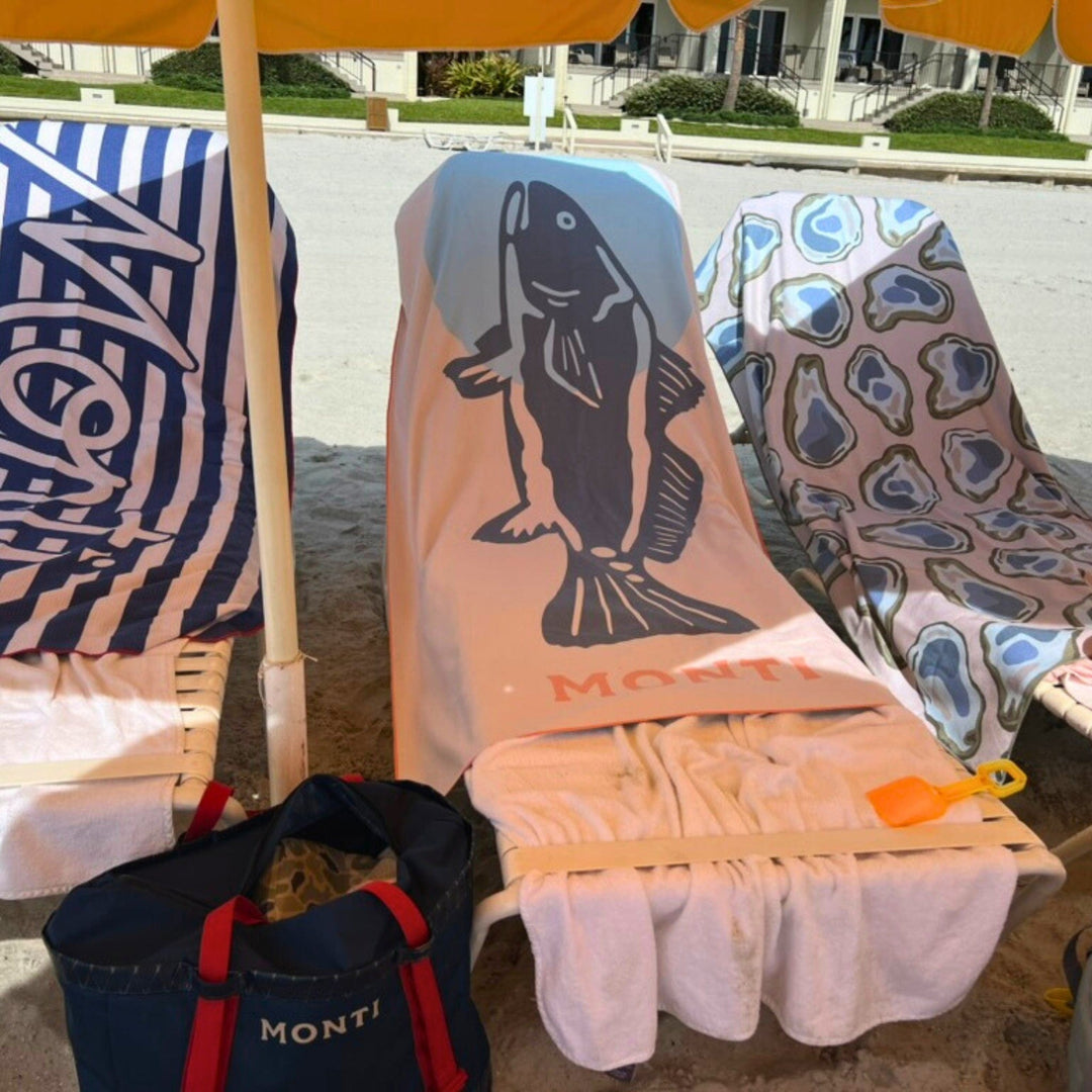 Monti Coolers The Big Ass Towel displayed flat, showcasing its large size and soft, absorbent fabric in a vibrant color.