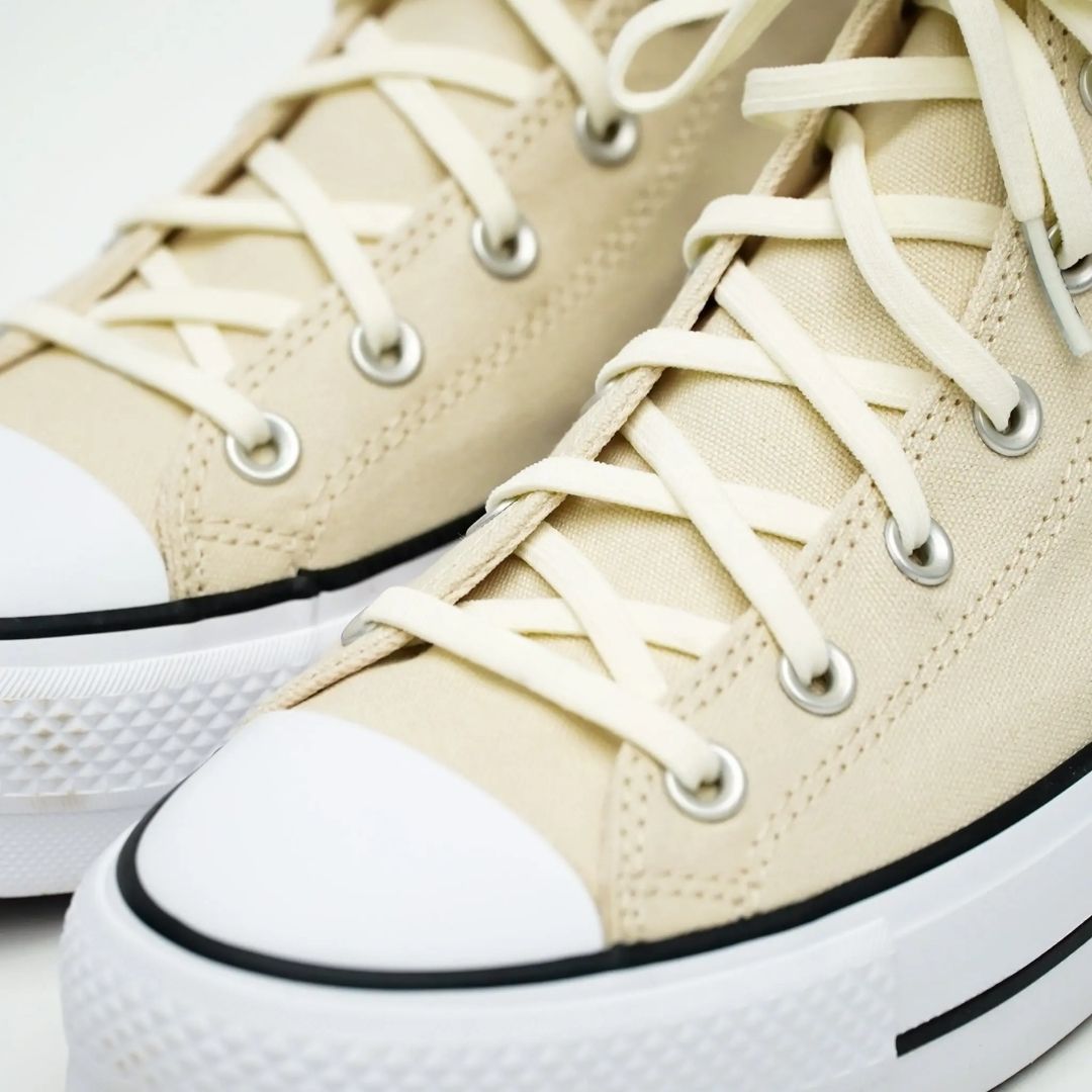 Elastic shoelace from Bread Luxe Creme collection, showcasing a sleek, flexible design in soft, cream color on a plain background.