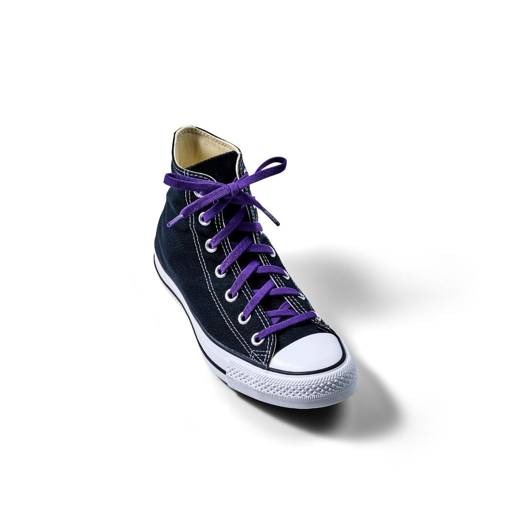 Elastic shoelace in cosmic purple by Bread, showing close-up of the vibrant, stretchy laces with black tips on a plain background.