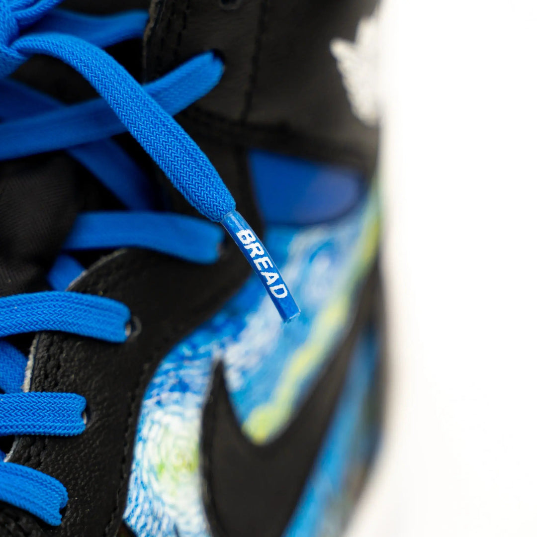 Blue elastic shoelace by Bread, shown in vibrant Sonic Blue, designed for easy and secure footwear fastening.