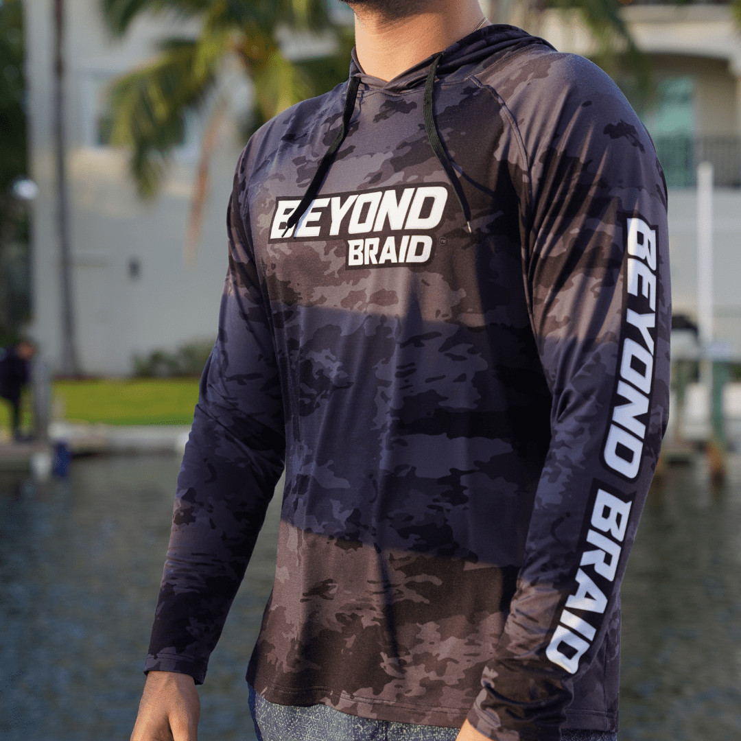 Beyond Braid long sleeve hooded performance fishing shirt, lightweight and breathable with UV protection, ideal for outdoor fishing.
