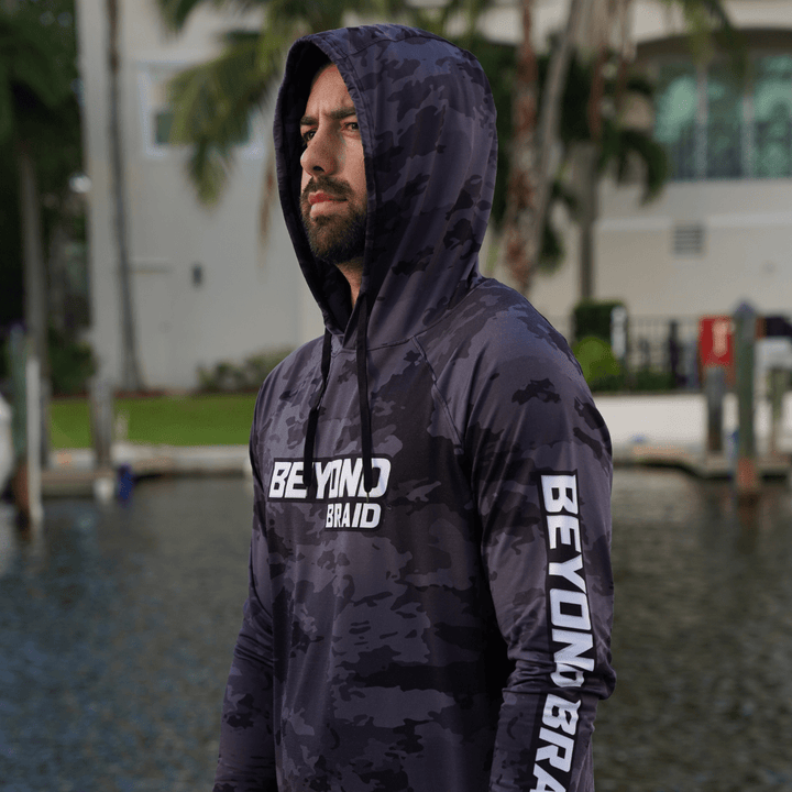 Beyond Braid long sleeve hooded performance fishing shirt with lightweight fabric and UPF sun protection, ideal for outdoor fishing.