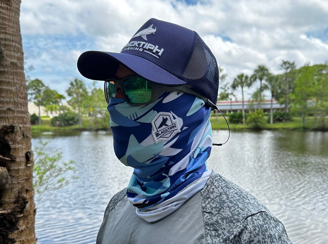 Light blue BlacktipH performance face shield worn as apparel accessory, showcasing lightweight, breathable design for active use.