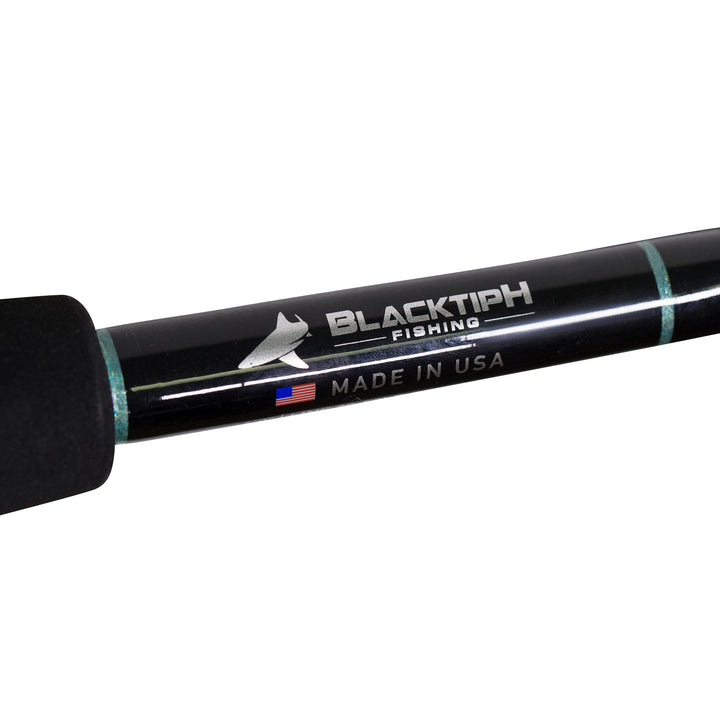 BlacktipH 30-50lb standup fishing rod with carbon fiber wrap, designed for saltwater fishing, featuring a sleek black finish.
