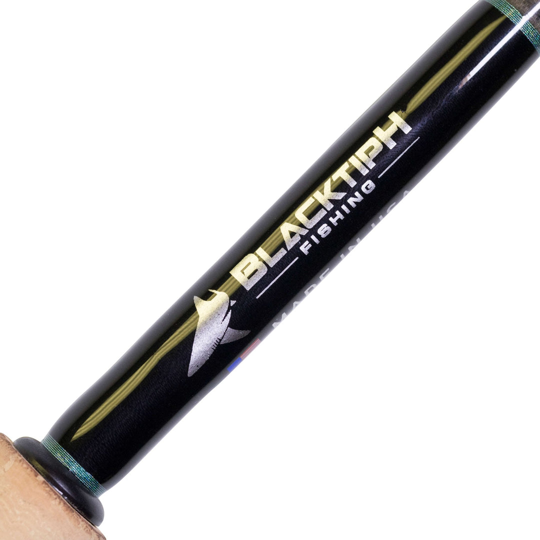 BlacktipH 6-12lb spinning fishing rod with split grip handle and graphite reel seat, designed for freshwater or saltwater fishing.