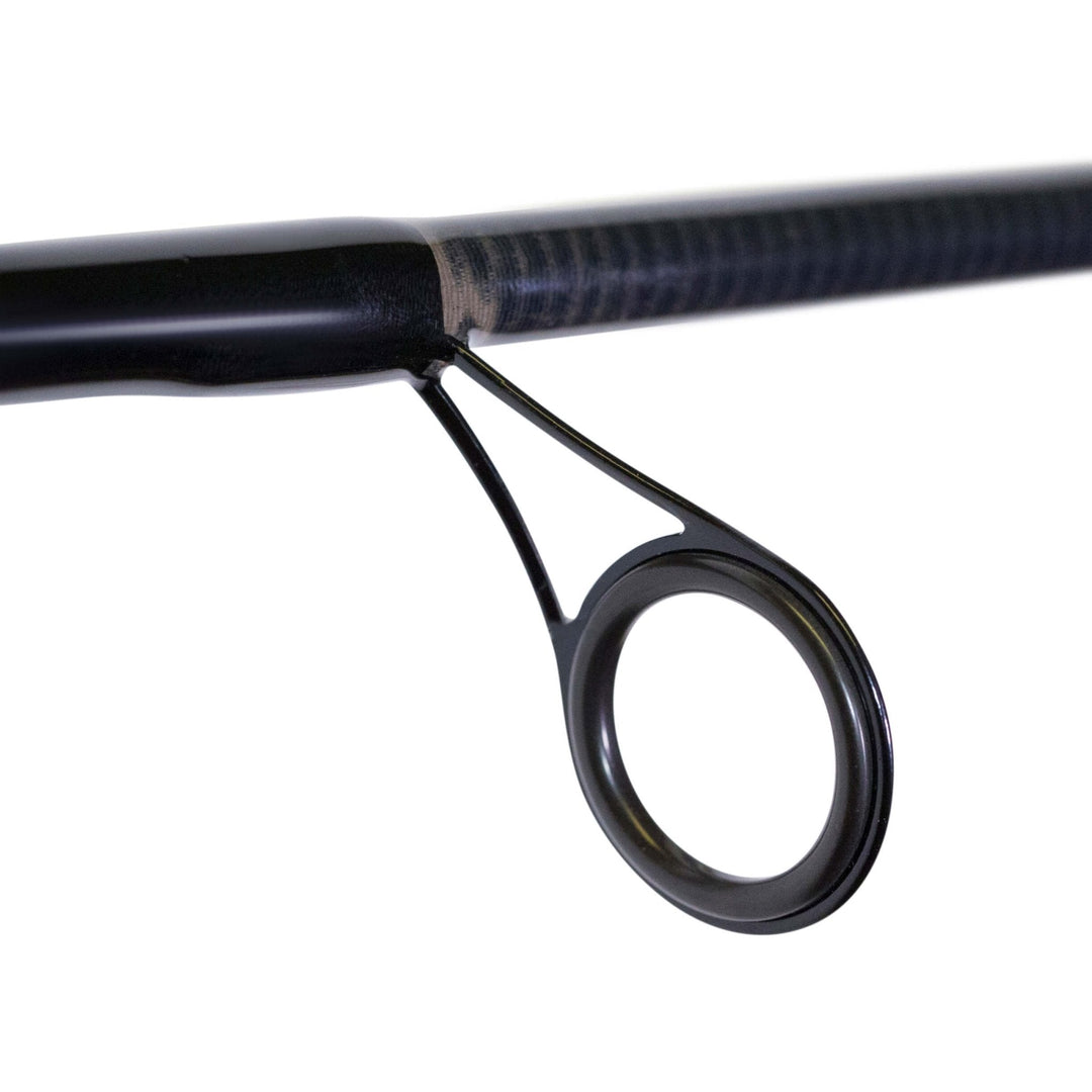 BlacktipH split-grip spinning fishing rod with graphite reel seat, designed for 6-12lb line, shown in a close-up shot.