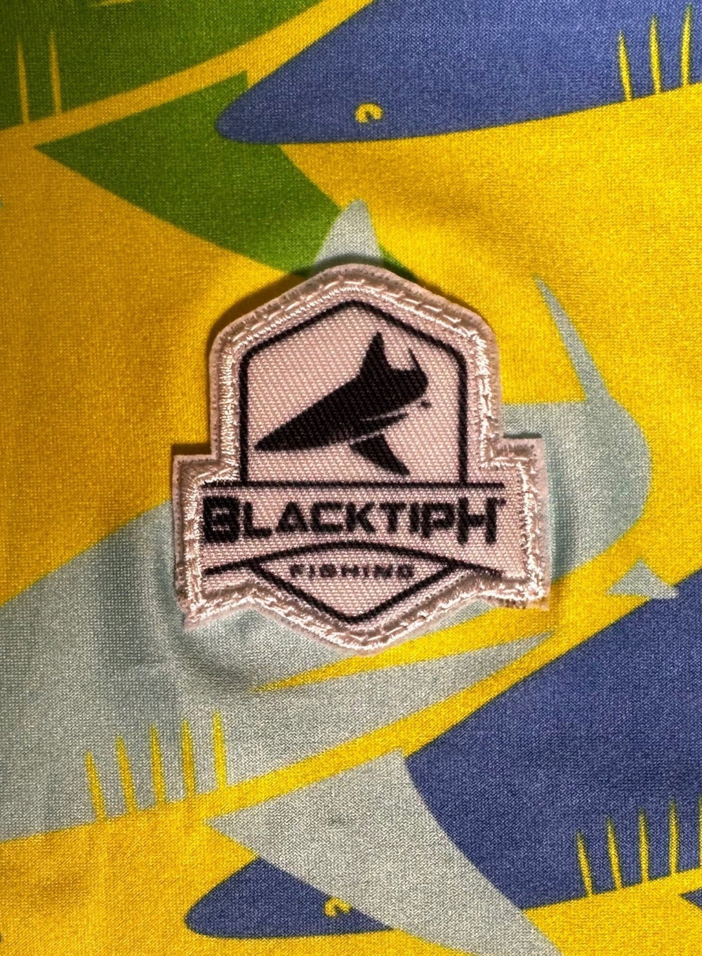 BlacktipH yellow green performance face shield as a neck scarf, designed for versatile face protection and neck coverage.