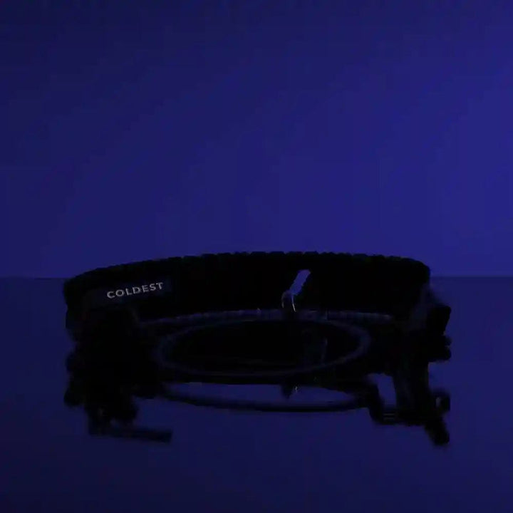 Coldest Glowie Paracords accessory with glowing features, shown with multiple colorful paracords on a neutral background.
