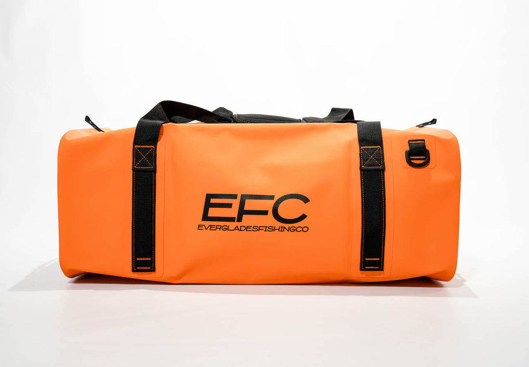 Everglades Fishing Co BALE BAG 50L dry duffel bag in bright orange, showing its durable fabric and spacious design.