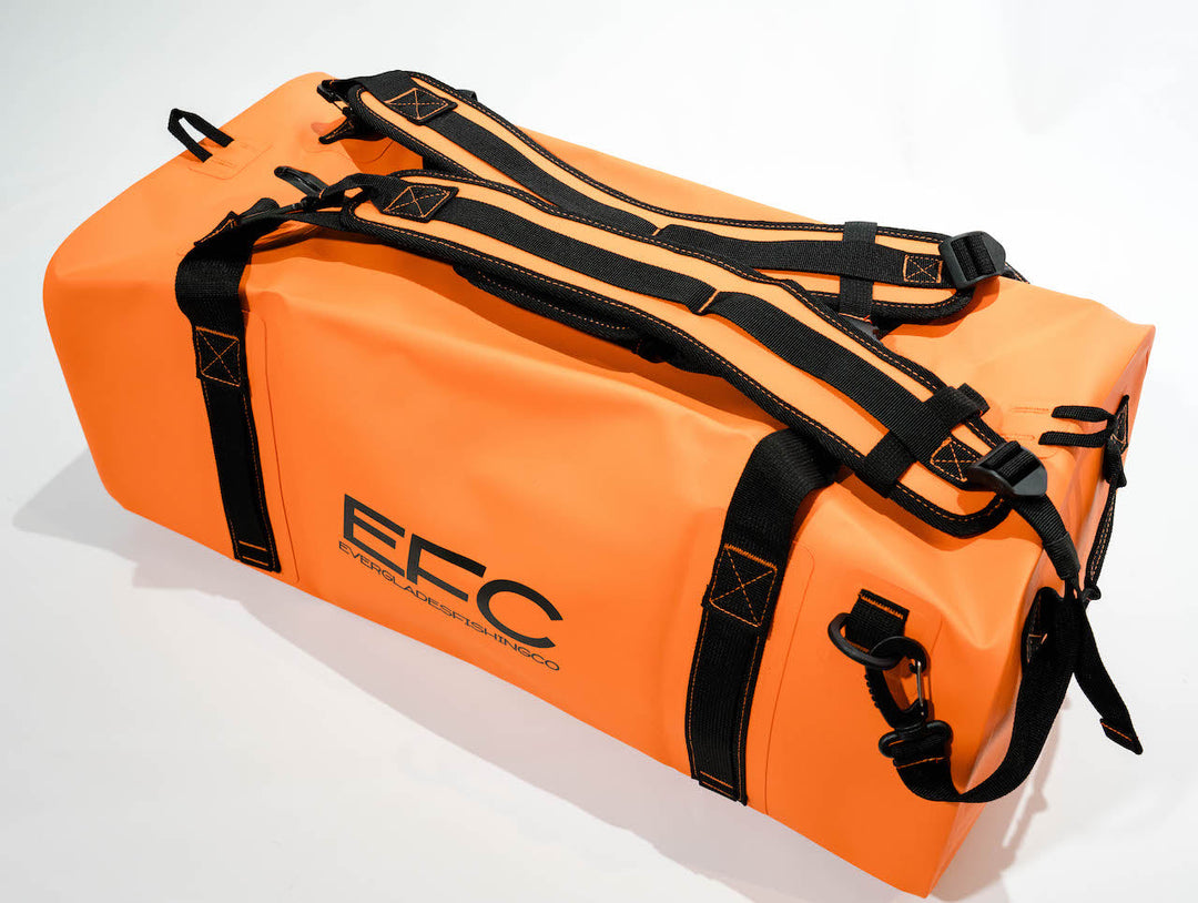 Orange BALE BAG 50L dry duffel bag by Everglades Fishing Co, showing durable waterproof material and sturdy handles.