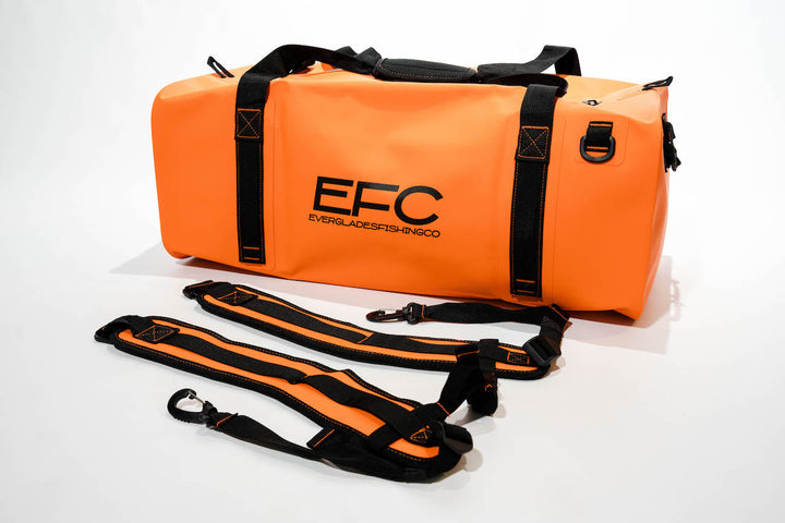 Orange BALE BAG 50L dry duffel bag by Everglades Fishing Co, showing durable fabric and adjustable shoulder straps.