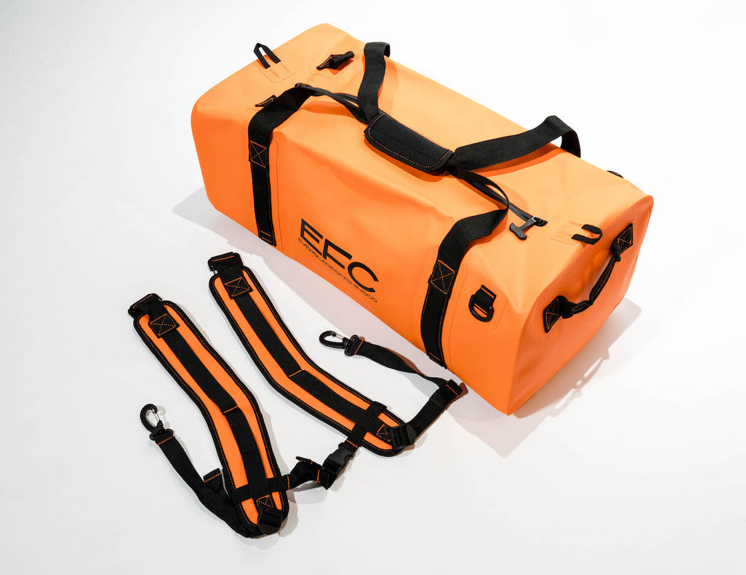 Orange BALE BAG 50L dry duffel bag by Everglades Fishing Co, shown with rugged nylon exterior and sturdy zipper closure.
