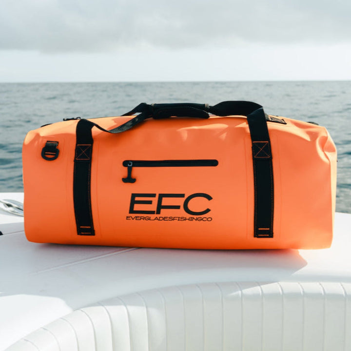 Orange BALE BAG 50L dry duffel bag by Everglades Fishing Co, showing its durable waterproof material and spacious design.