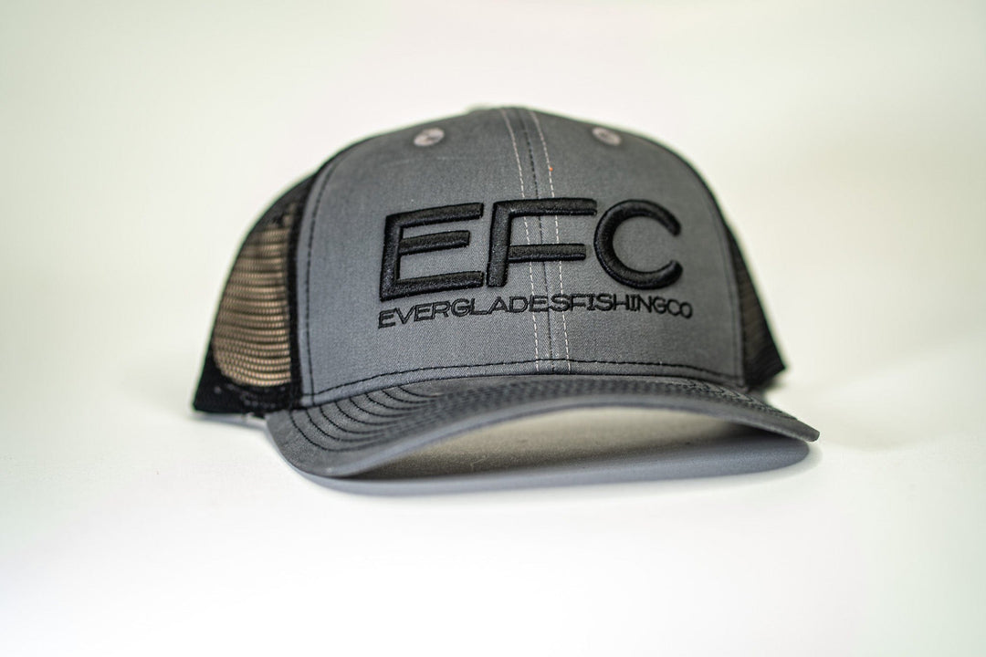Black classic snapback hat by Everglades Fishing Co featuring a curved brim and adjustable strap, displayed on a mannequin head.