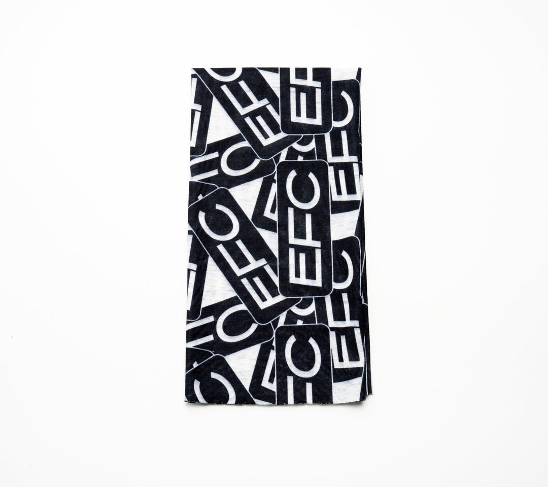 Bright orange EFC Buff by Everglades Fishing Co, made of stretchy fabric, shown laid flat on a white background.