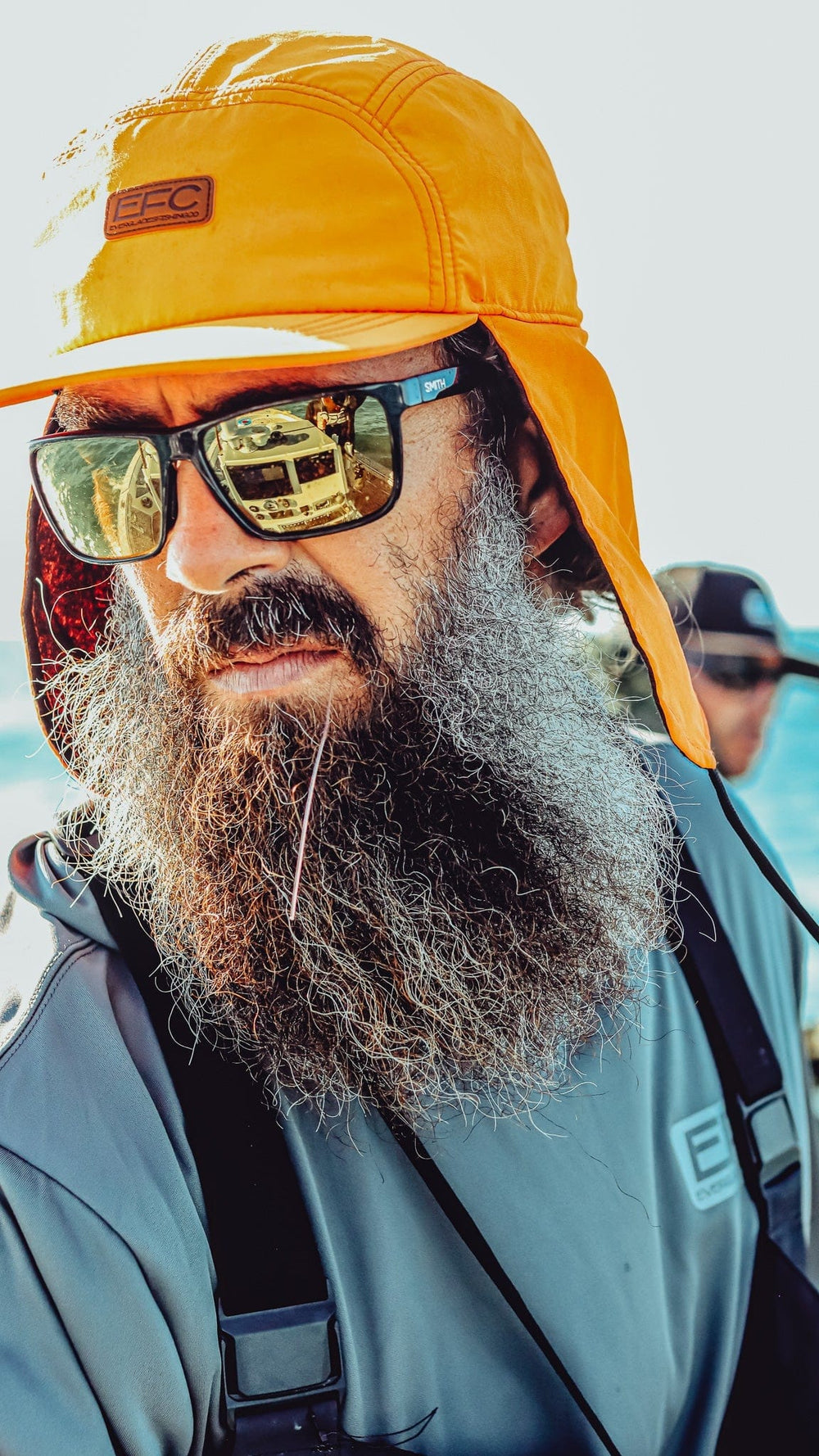 Everglades Fishing Co EFC ear flap hat with warm fleece lining and adjustable chin strap for outdoor fishing and cold weather.