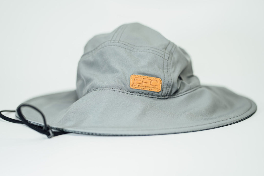 Gray bucket hat by Everglades Fishing Co, shown on a man, with a wide brim and casual style for outdoor wear.